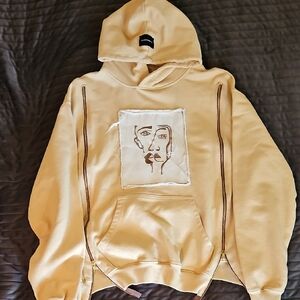 Beige Hoodie with Artistic Face Design Designer LA MAINGRETTE S.M Unisex